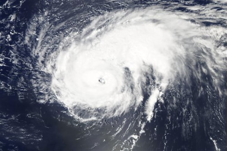 This image provided by NASA shows a natural-color image of Hurricane Danielle taken at 12:50 p.m. EDT on Aug. 26, 2010  by the Moderate Resolution Imaging Spectroradiometer (MODIS) on NASA?s Aqua  satellite. Looking like a giant comma turned on its side, Danielle sported a distinct eye. The storm?s longest spiral arms stretched toward the northeast. (AP Photo/NASA)